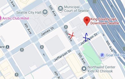 Image of google maps location of the King County Jail. A red X on 5th Avenue indicates the main exist, a blue X on Jefferson is the secondary exit. 